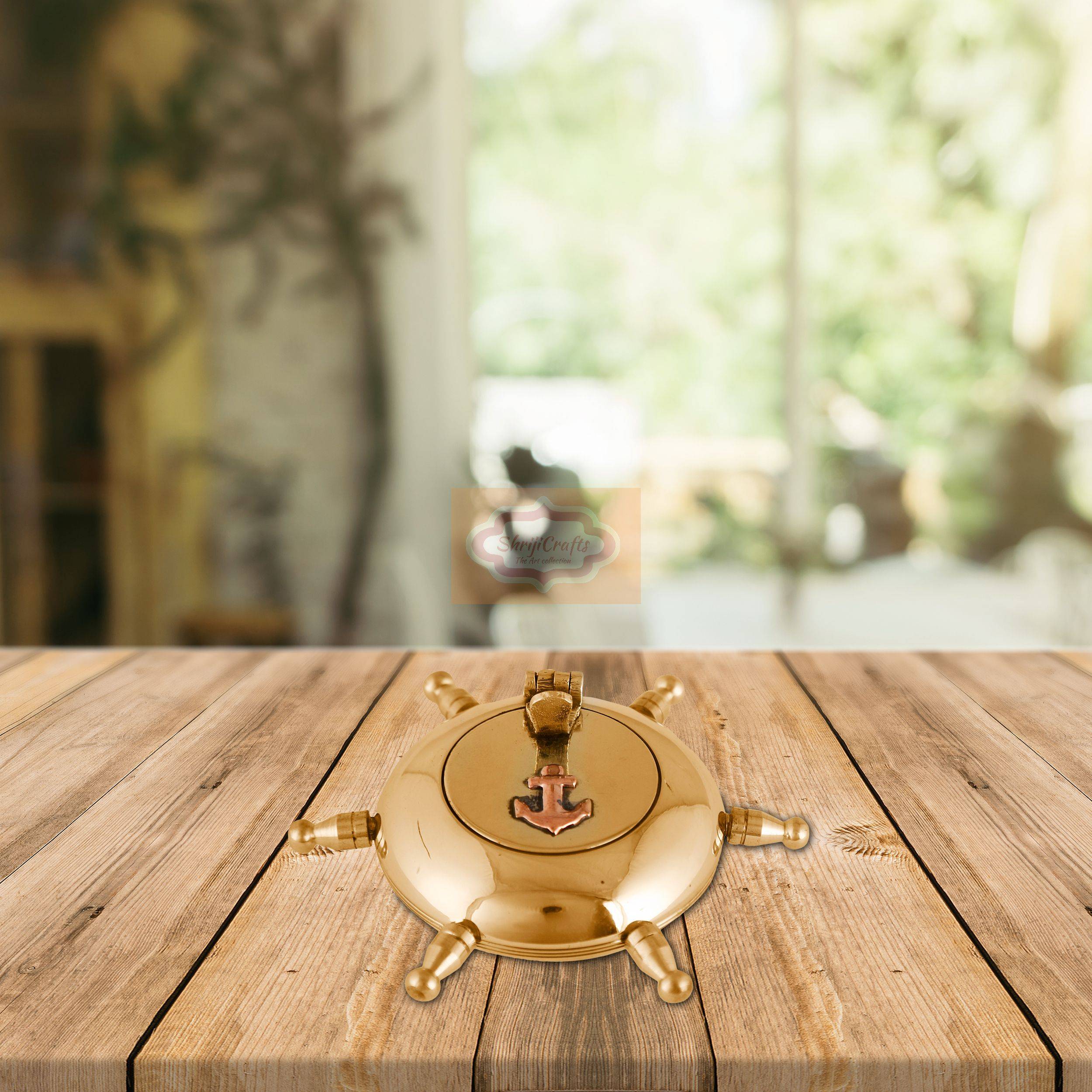 Handcrafted brass ashtray with a unique ship wheel design and rotating lid - View 5