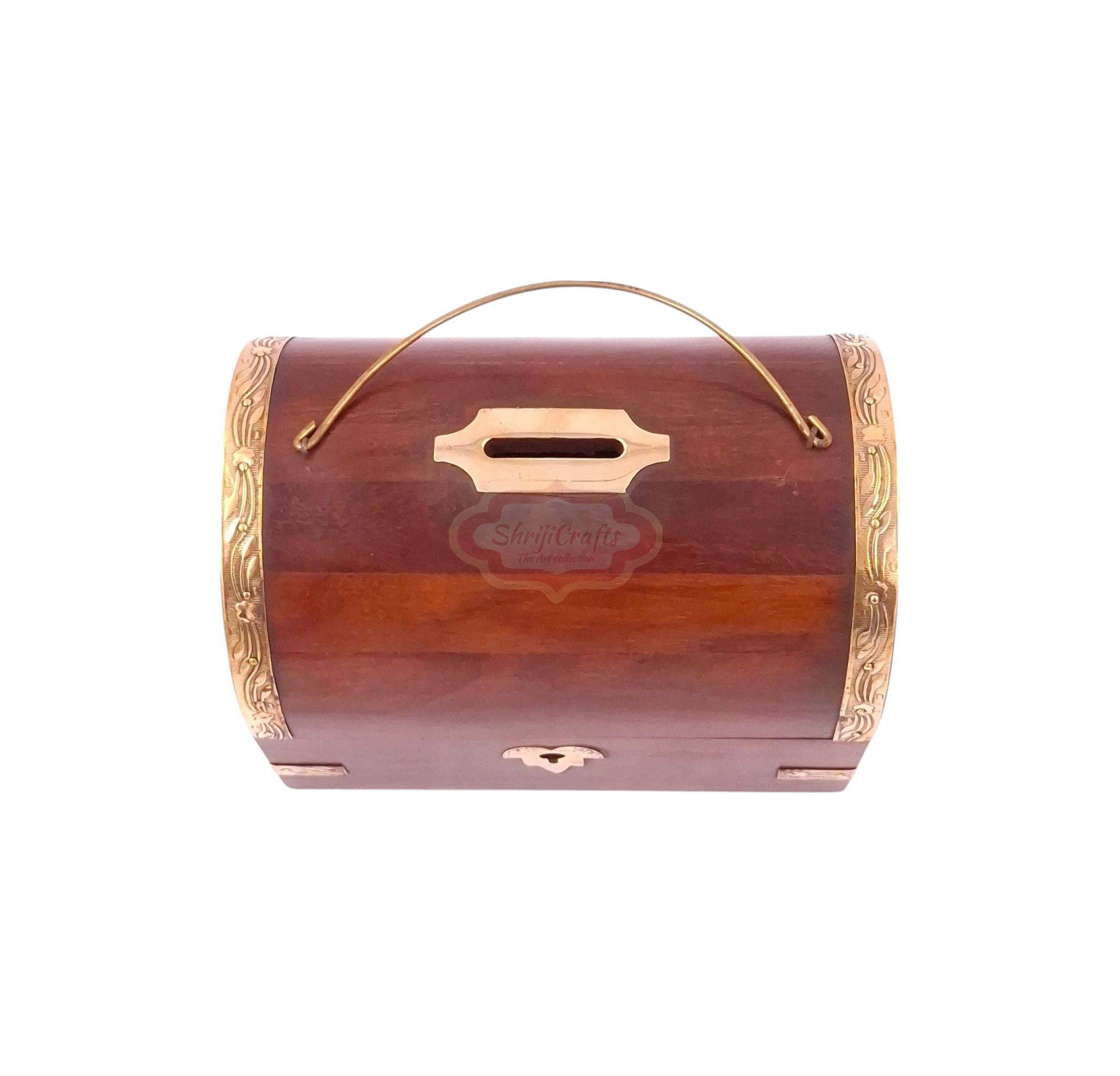 Handcrafted treasure chest-style wooden money bank with a coin slot, secure lock, and key - View 3