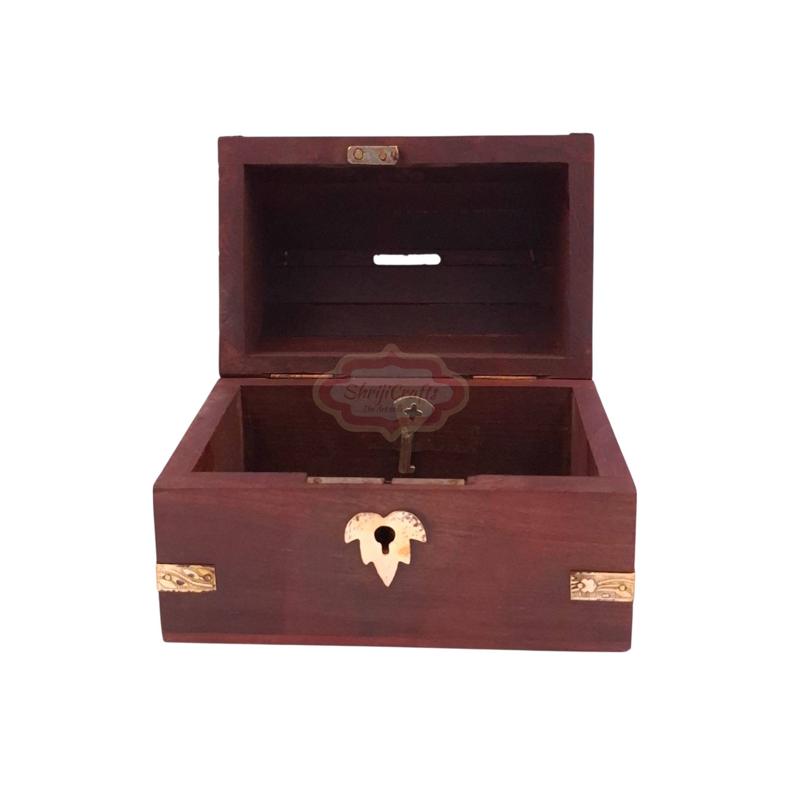 Handcrafted treasure chest-style wooden money bank with a coin slot, secure lock, and key - View 5
