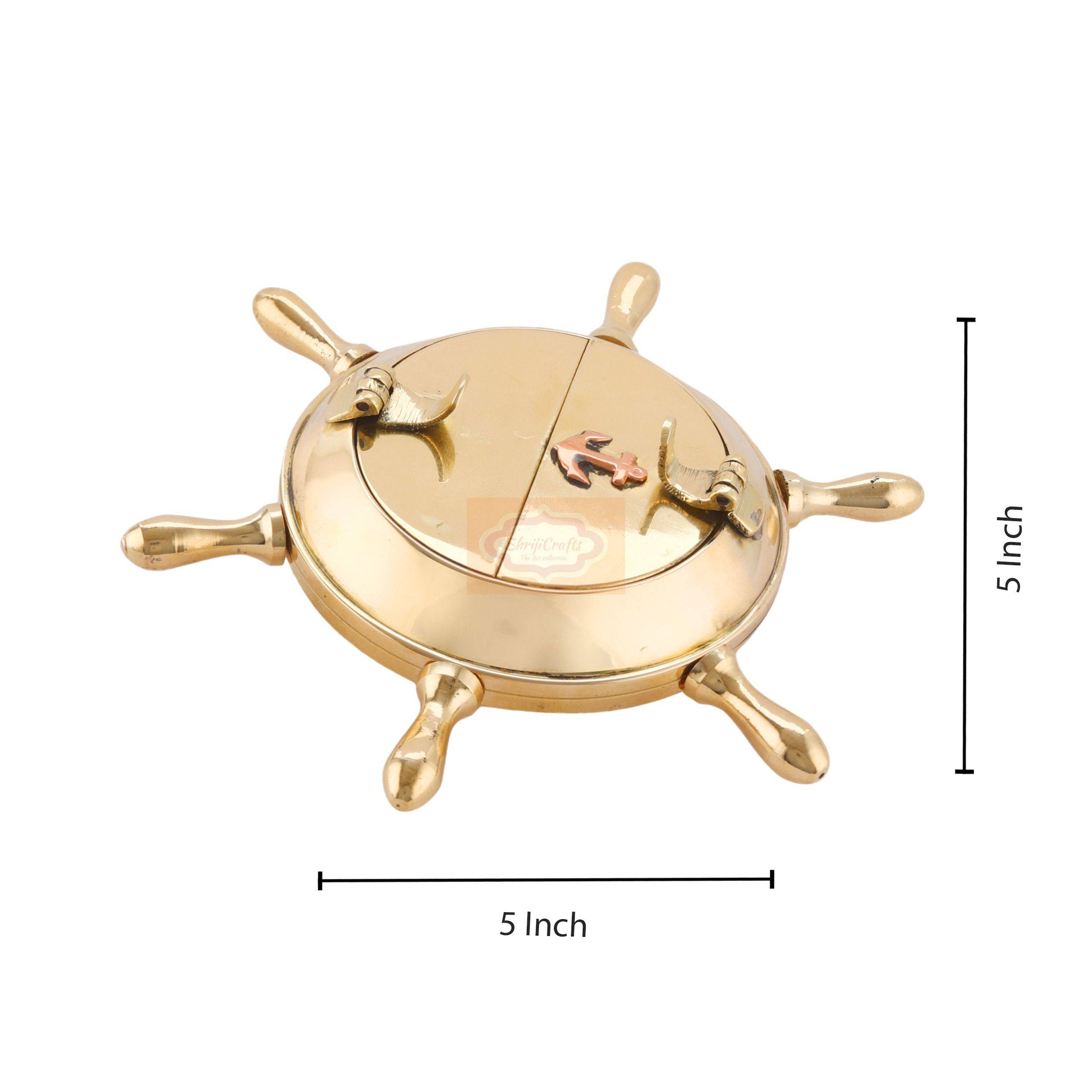 Handcrafted brass ashtray featuring a classic nautical ship wheel design with a polished finish - View 6
