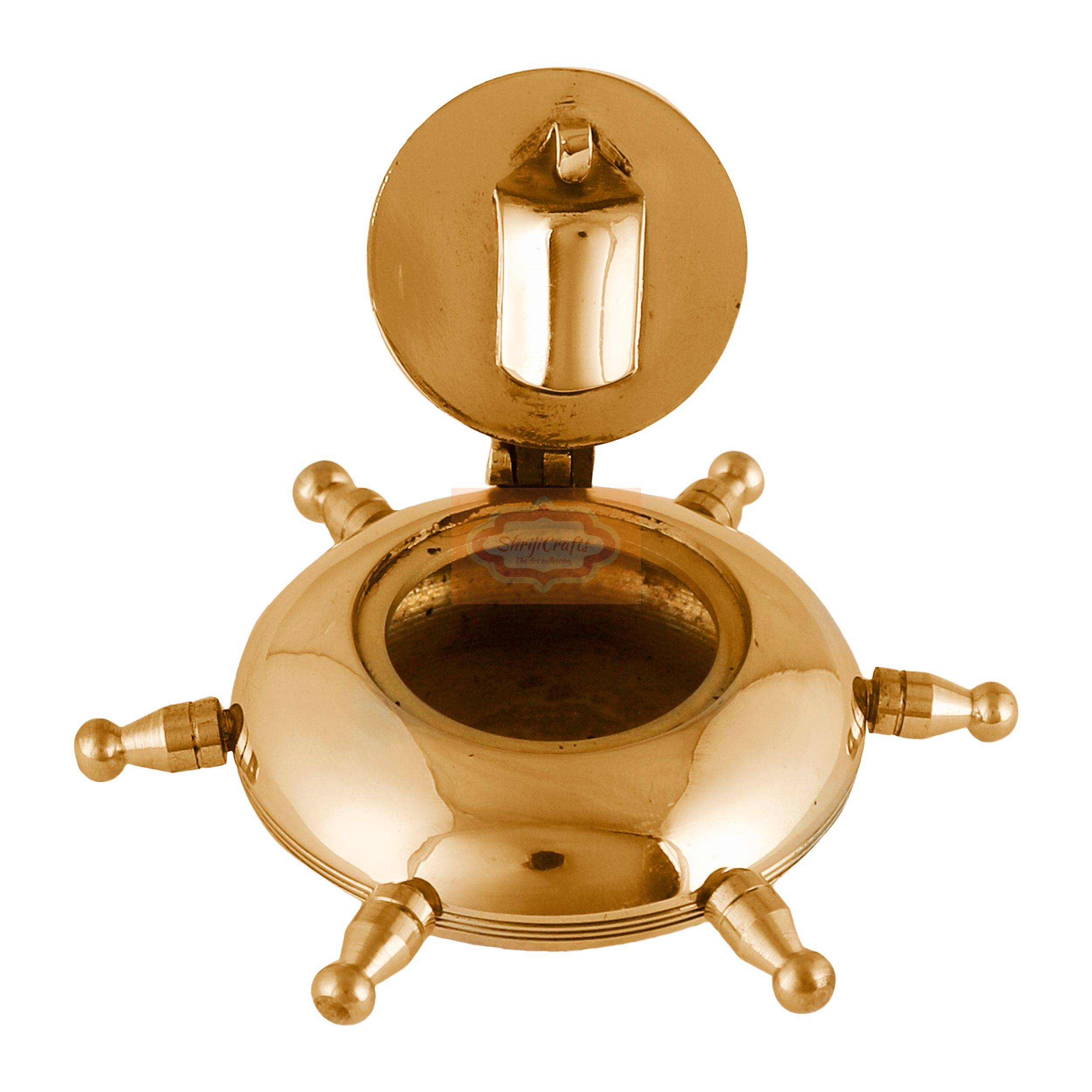 Handcrafted brass ashtray with a unique ship wheel design and rotating lid - View 3
